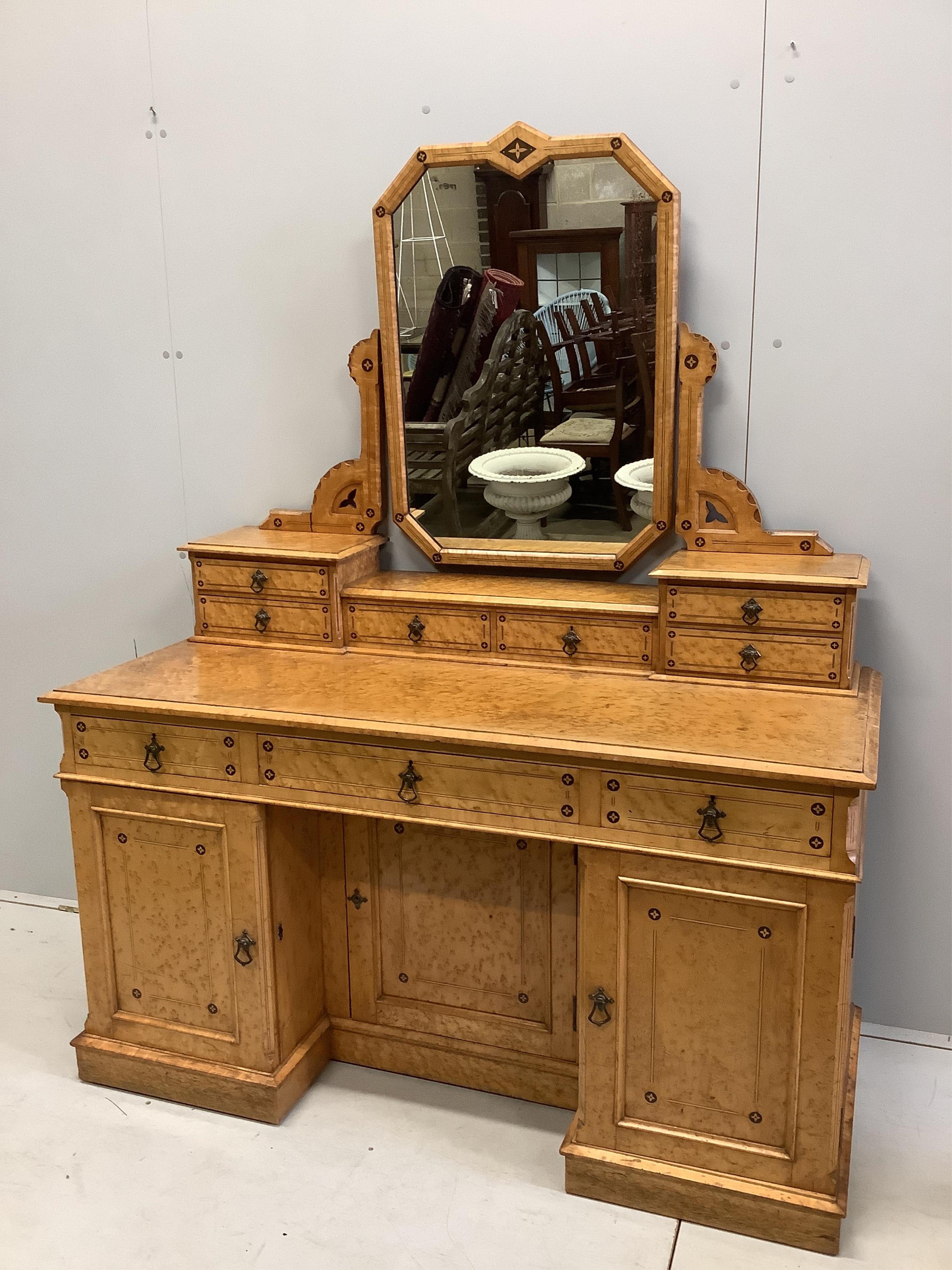 A late Victorian Gothic revival ebony inlaid, bird's eye maple bedroom suite, manner of Charles Bevan, comprising 5ft bed frame, kneehole dressing table, chest of drawers, marble top washstand, bedside cabinet, commode a